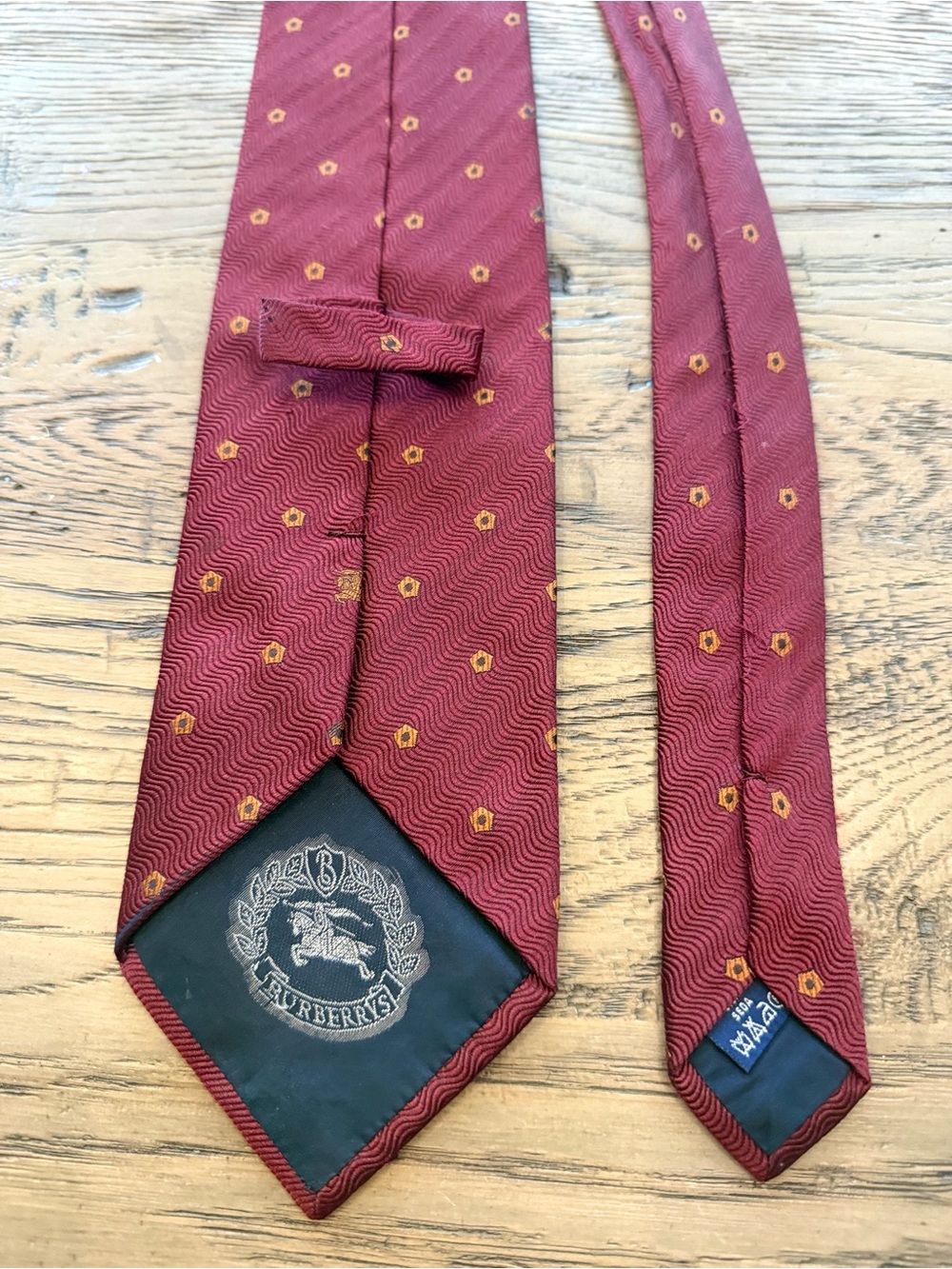 Burberry Men's Wine Red Silk Tie with Gold Motif